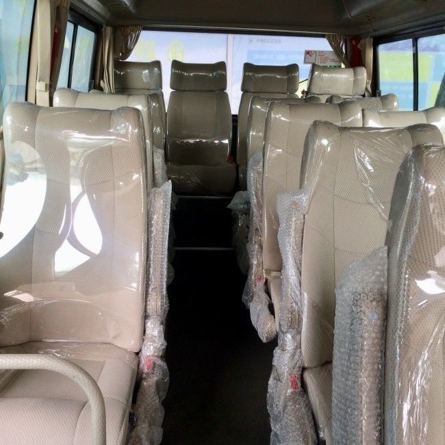 Bus Coaster Diesel 32 Kursi dengan AC dan Kontrol Traksi untuk Transportasi Penumpang yang Aman